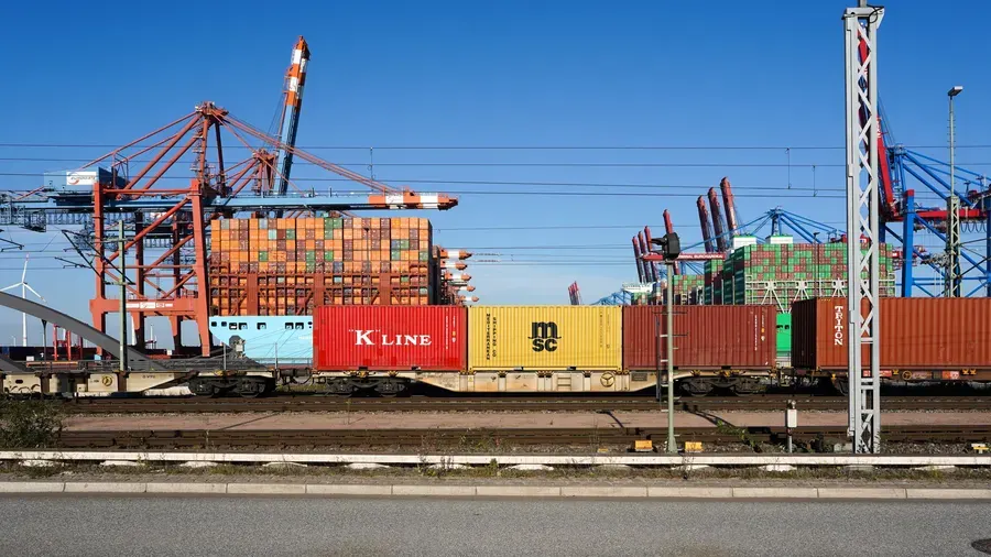 Container cranes and a freight train at a port