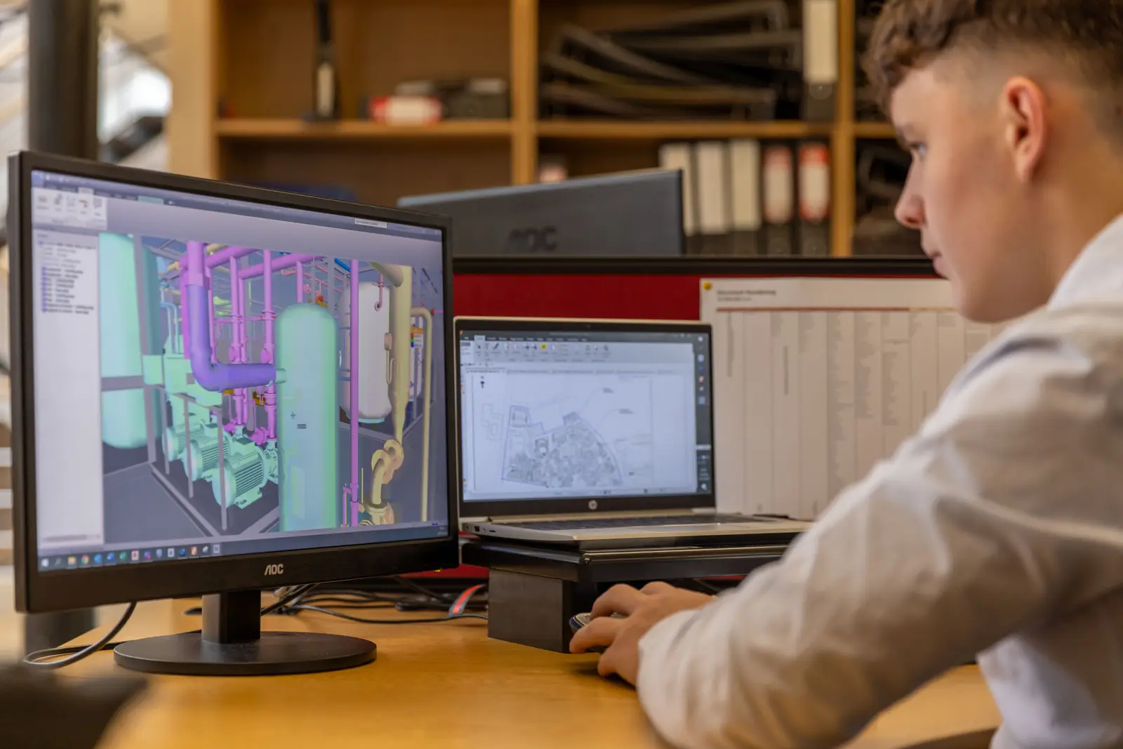 Engineer reviewing a building services design on screen